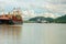 Freighter at the Pedro Miguel locks on the Panama canal. Bridge of the Americas in the background