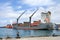 Freighter unloading cargo in port of Avatiu Rarotonga Cook Islands