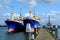Freighters at pier in Netherlands by blue sky