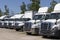 Freightliner and Navistar International Semi Tractor Trailer Trucks Lined up for Sale