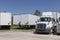 Freightliner Semi Tractor Trailer Trucks Lined up for Sale. Freightliner is owned by Daimler