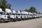 Freightliner and Volvo Semi Tractor Trailer Trucks Lined up for Sale. Freightliner is owned by Daimler