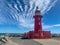 Fremantle, Western Australia - Mar 5, 2022: The lighthouse on the end of North Mole at the entrance to Fremantle Harbour on a