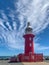 Fremantle, Western Australia - Mar 5, 2022: The lighthouse on the end of North Mole at the entrance to Fremantle Harbour on a