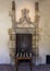 French 15th century limestone doorway with oak door in the Cloisters in New York City.