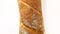 French baguette loaf rotation, turning counterclockwise, on white background, top view.