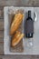 French baguette, wine glasses and bottle of red wine