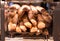 French Baguettes in bakery store. Freshly baked loaves on bakery racks.