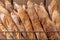 French baguettes in metal basket in bakery