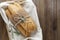 French baguettes on wooden table, rustic style. Pastry, breakfast, bread for sandwich isolated, copy space