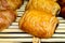 French bakery, fresh baked sweet buns and rolls on display in small French bakery in Paris