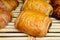 French bakery, fresh baked sweet buns and rolls on display in small French bakery in Paris