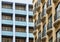 French balconies contrasting with the postmodern architecture of blue balconies