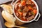 French beef stew in red wine known as daube de boeuf Provencal closeup in the wooden tray. Horizontal top view