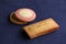 French biscuit Financier and cookies  on navy blue table cloth