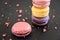 French biscuit macarons on the dark background