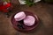 French blackcurrant macaron with cream cheese filling. Still life with berries tea