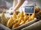 French Bread baguettes in basket with chef rolling dough in background