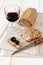 French bread with olives, Provencal olives and a glass of red wi