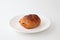 French bread pain au chocolat chocolate croissant on plate on white background