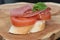 French bread topped with tomato and ham
