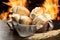 French breads in basket with blurred fire background