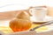 French Brioche and white cup of Coffee