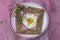 French Buckwheat crepe galette with ham and egg for tasty healthy lunch on a pink wooden background