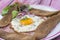 French Buckwheat crepe galette with ham and egg for tasty healthy lunch on a pink wooden background