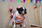 French bulldog in colorful dress at the festa junina stall