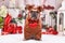 French Bulldog dog wearing Valentine`s day teddy bear costume holding heart in front of seasonal decoration