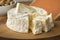 French Camembert cheese on a cutting board