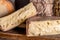 French cheese Saint Nectaire rustic collection delicious. Black background.