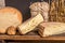 French cheese Saint Nectaire rustic collection delicious. Black background.