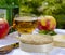 French cheeses collection, piece of fermented cow milk cheese Camembert au Calvados served with French dry apple cider outside in