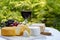 French cheeses collection, yellow Riche de Saveurs, Vieux Pane and Le peche des bons peres cheeses served with glass of red port