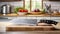 A French chef\\\'s knife sitting on a chopping board against blurred kitchen background copy space