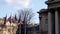 French and Chinese flags in the wind in front of National Assembly