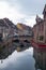 The French city of Colmar on Christmas Eve. People on a boat are sailing on the canal.