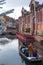 The French city of Colmar on Christmas Eve. People on a boat are sailing on the canal.