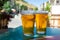 French cold beer in misted glasses served on outdoor terrace in small Alpine village in France