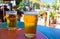 French cold beer in misted glasses served on outdoor terrace in small Alpine village in France