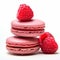 French colorful macarons with raspberries on white background