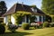 french country house with hipped roof and a neatly trimmed hedge