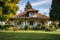 french country house with hipped roof and wooden shutters