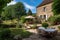 french country house with terraced garden, outdoor dining area and scenic views