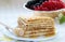 French crepe pancakes with fresh berries and honey