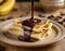 French crepes with bananas, topped with dark chocolate. Sweet breakfast. Wooden table