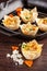 French cuisine concept. Mini cake Kish from pumpkin and goat cheese with filo dough. Cupcake baking dish. European appetizer