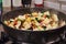 French cuisine ratatouille salad in frying pan on gas stove